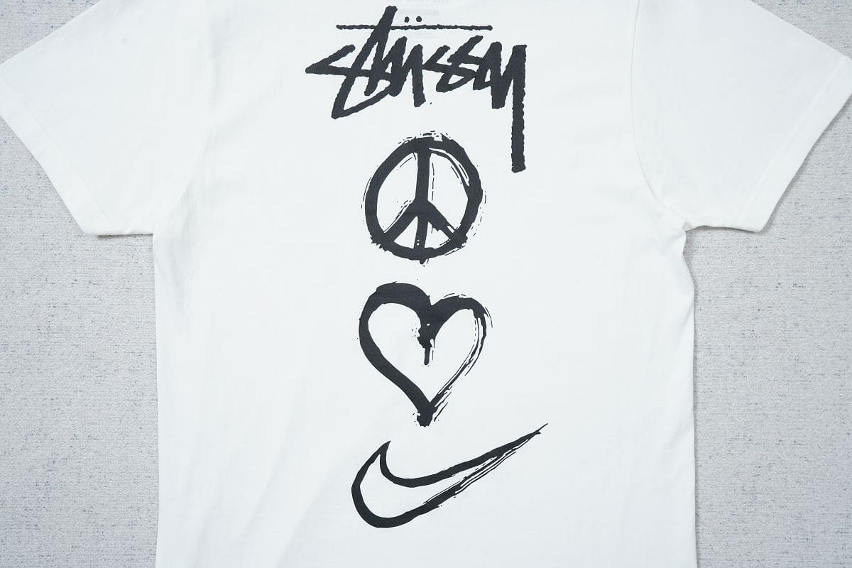 Camiseta Nike x Stussy Peace Love Swoosh